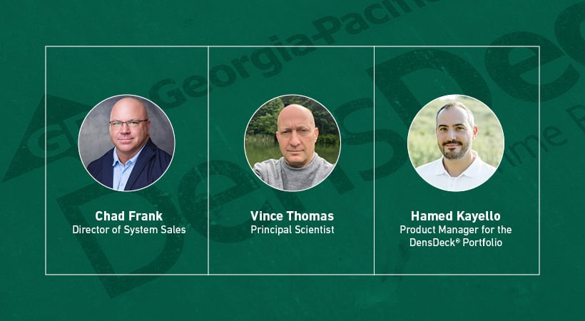 The aftermath of a flooded commercial building, gutted down to the concrete, load-bearing walls, with debris littering the floor.